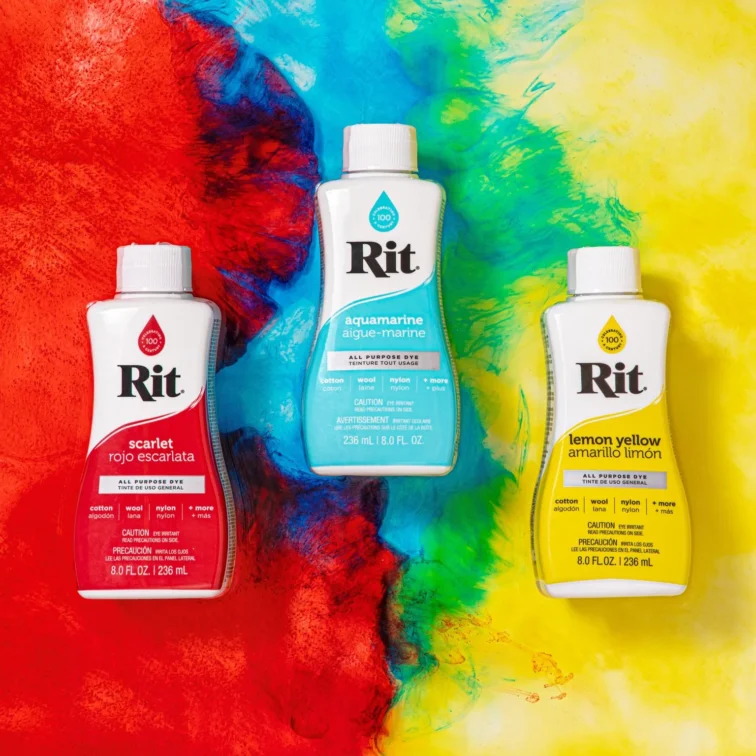 A variety of Rit All-Purpose Liquid Dye products over a colorful abstract background
